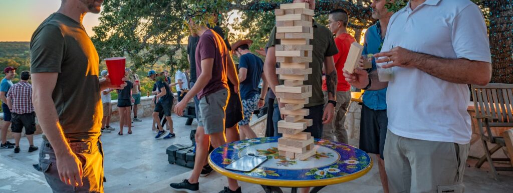 business retreat games and drinks on the patio at sunset