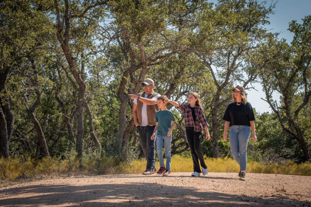 family on hill country hiking expedition