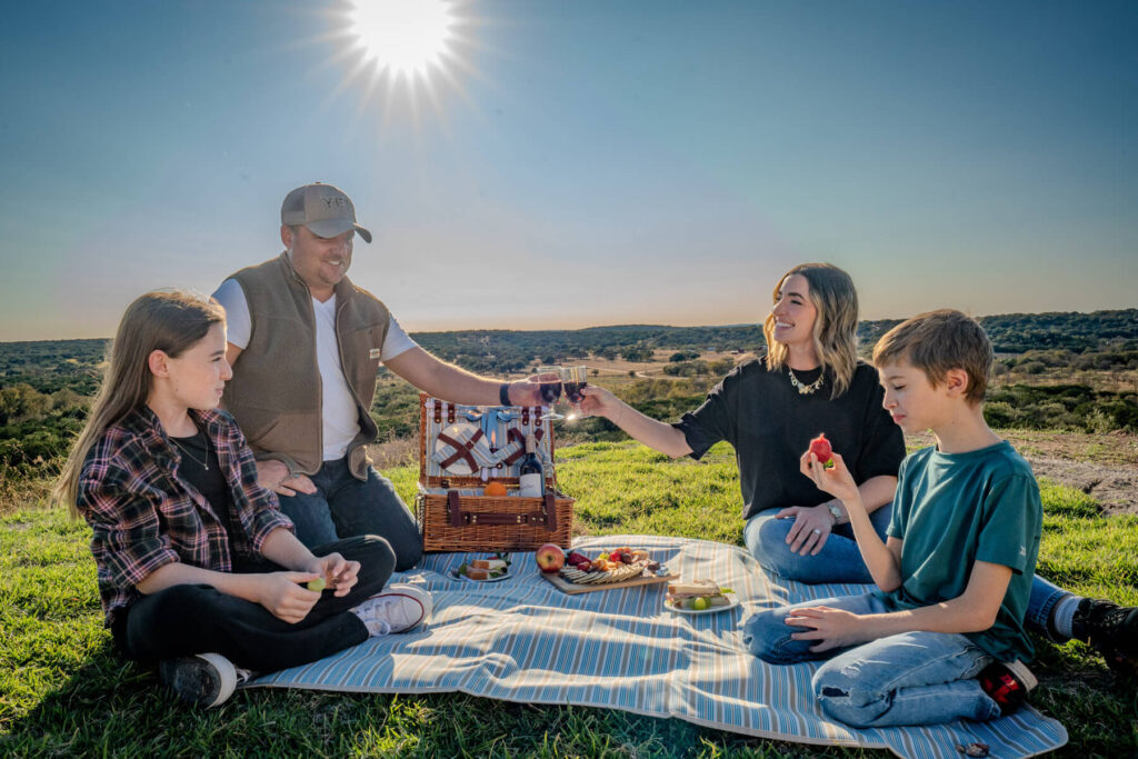 Family picnic adventure overlooking amazing summer ranch view