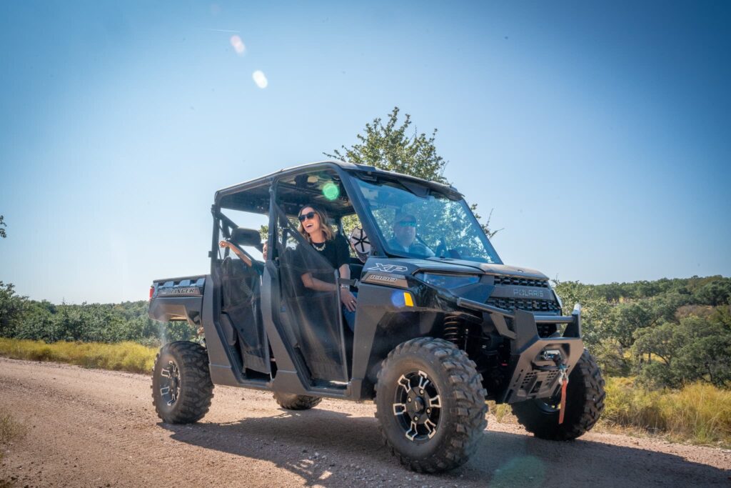 family on ATV ranch adventure spotting wildlife