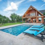 comfortable and relaxing private vacation rentals on the outdoor patio, pool and lawn