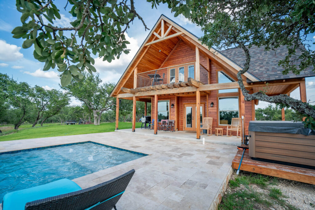 private pool and hot tub patio area overlooking expansive views
