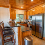 Complimentary wine and snacks on the kitchen counter at The Cottage