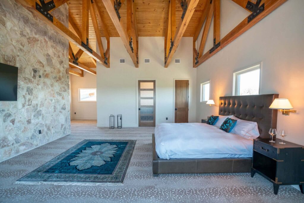 Stunning oversize master suite with king size bed and comfortable spaces to relax