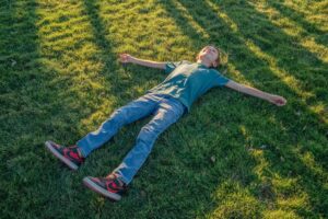 Blissfully relaxing on the lawn at sunset