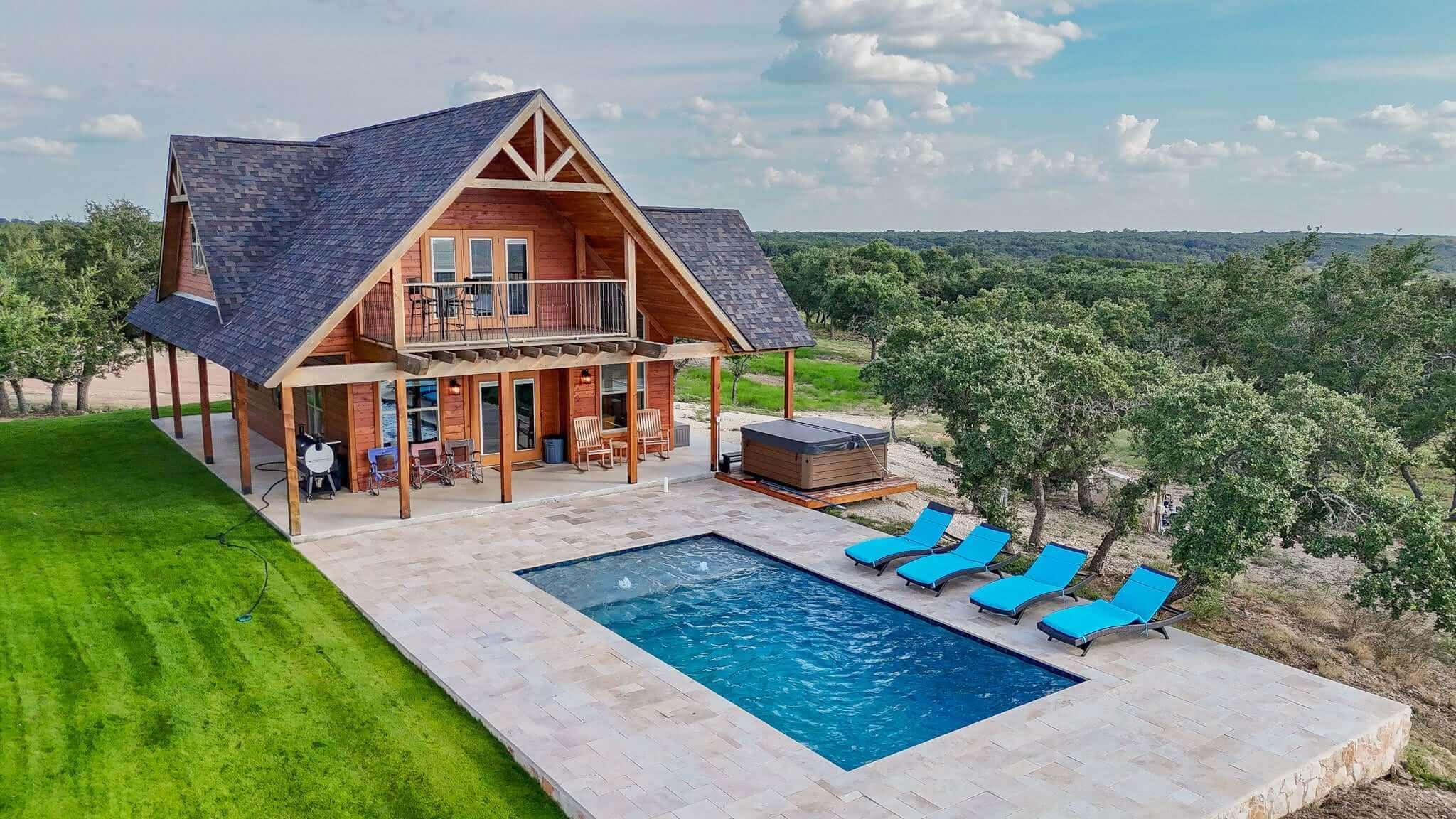 Outdoor amenities at Artemis Cottage - aerial view of pool, patio and hot tub