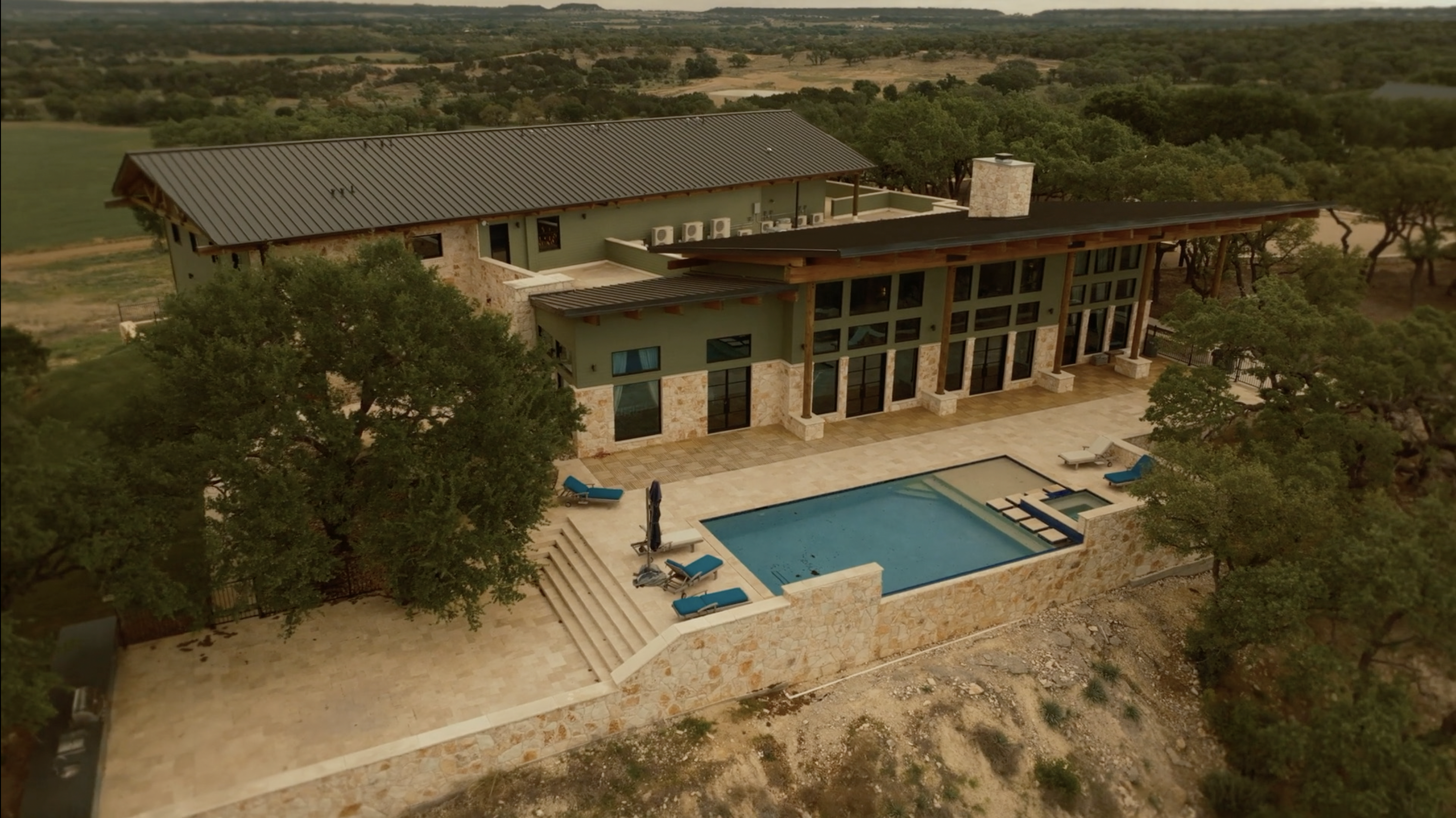 Artemis Lodge exterior with pool and Great Room glass wall