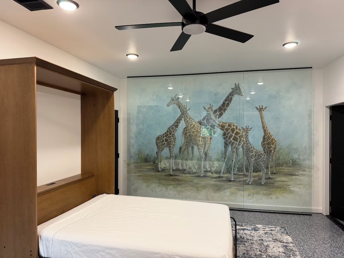 Giraffe House bedroom with giraffe mural, ideal for couples and wildlife lovers