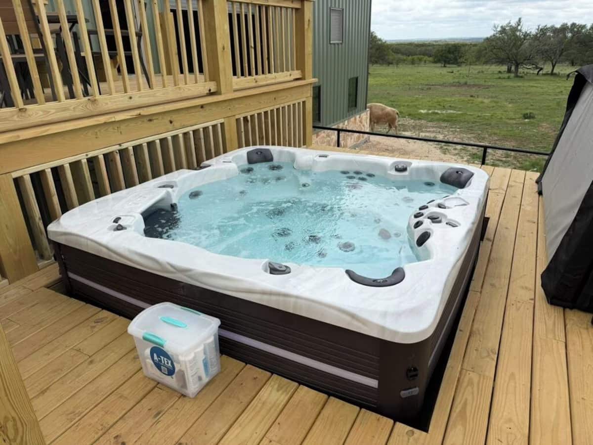 Outdoor amenities at Giraffe House - deck hot tub with pasture view